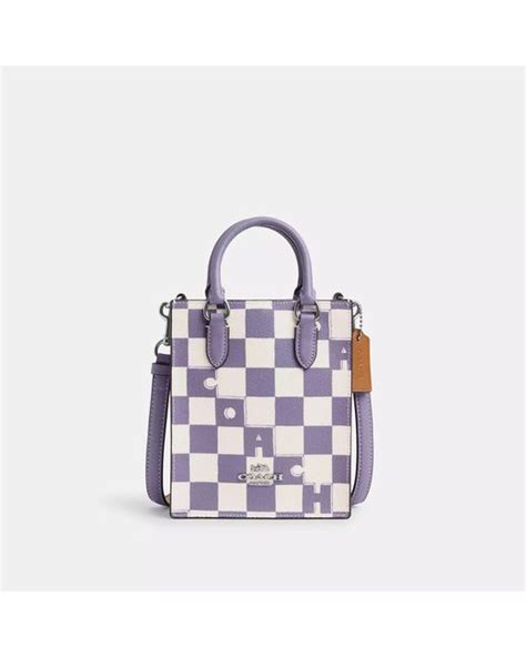 coach purple checkerboard tote.